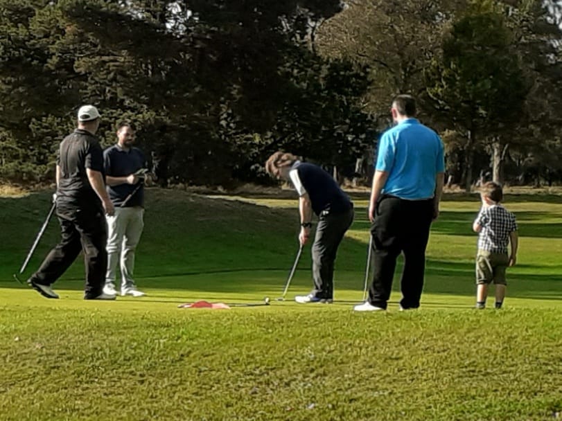 A young gatecrasher storms the 18th green