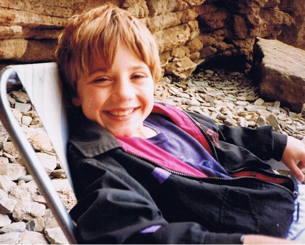 Chris aged about 6, on the beach