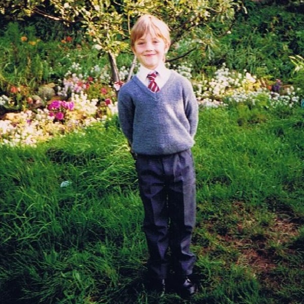 Chris in school uniform